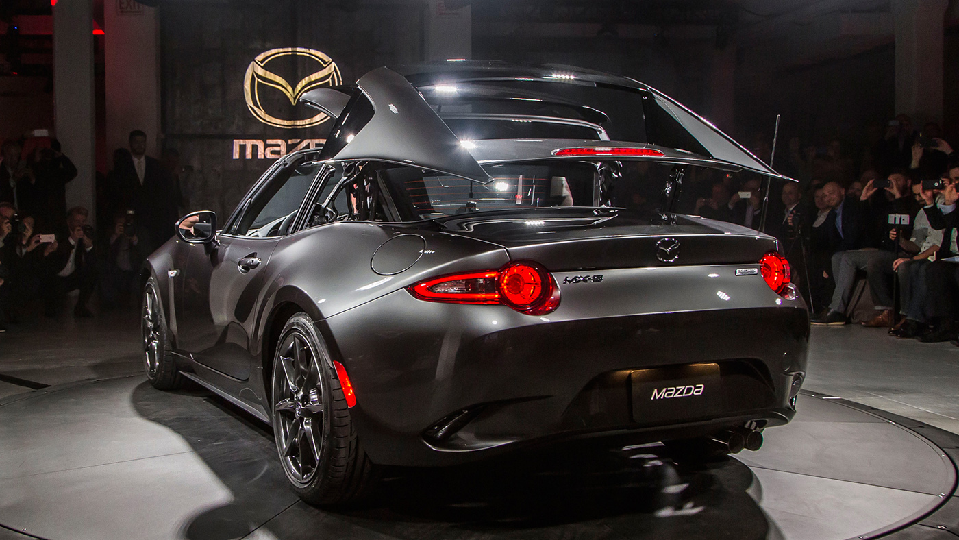 2017-Mazda-MX-5-Miata-RF-on-stage-rear-side-view-top-folding.jpg